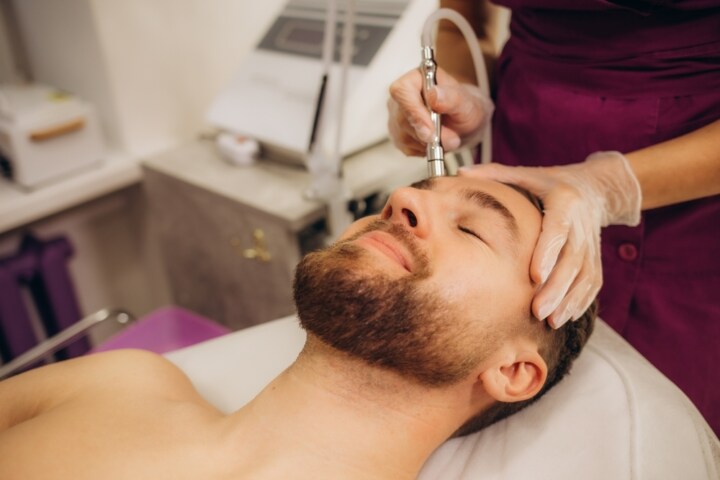 man having facial Microdermabrasion and Sonophoresis treatment
